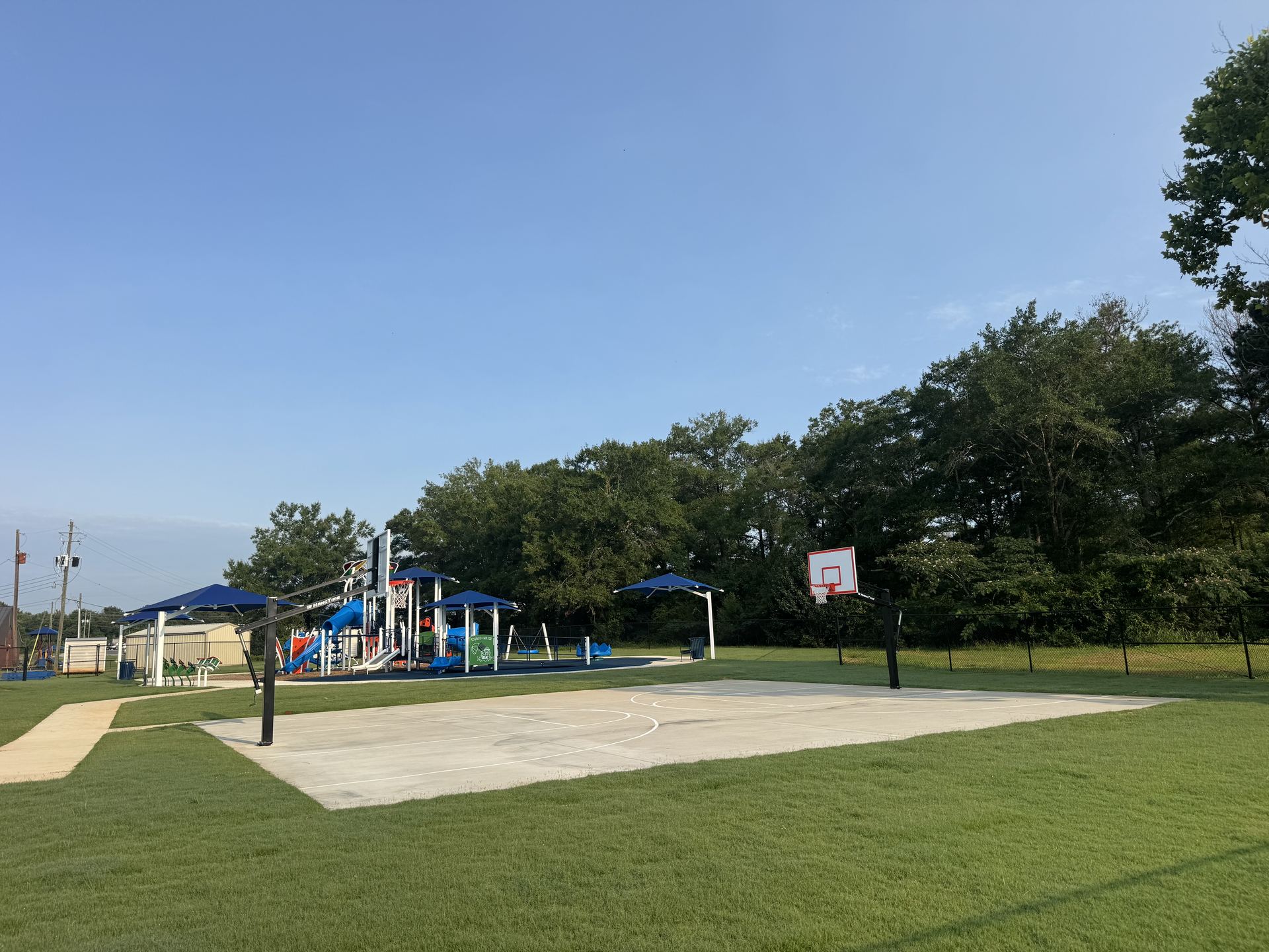 Childersburg Playground with basketball court and shaded play structure