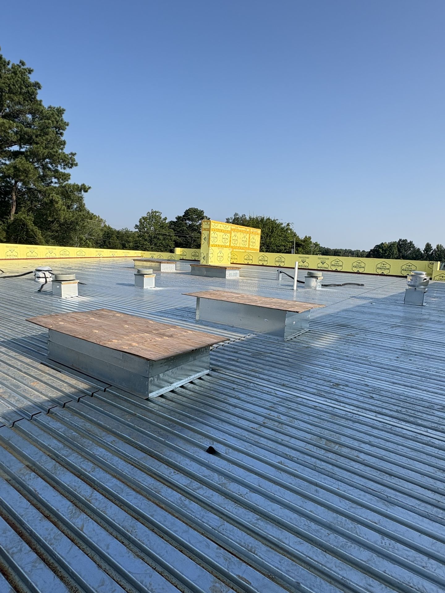 Metal roof decking and curbed roof penetrations on the Hartselle fire station